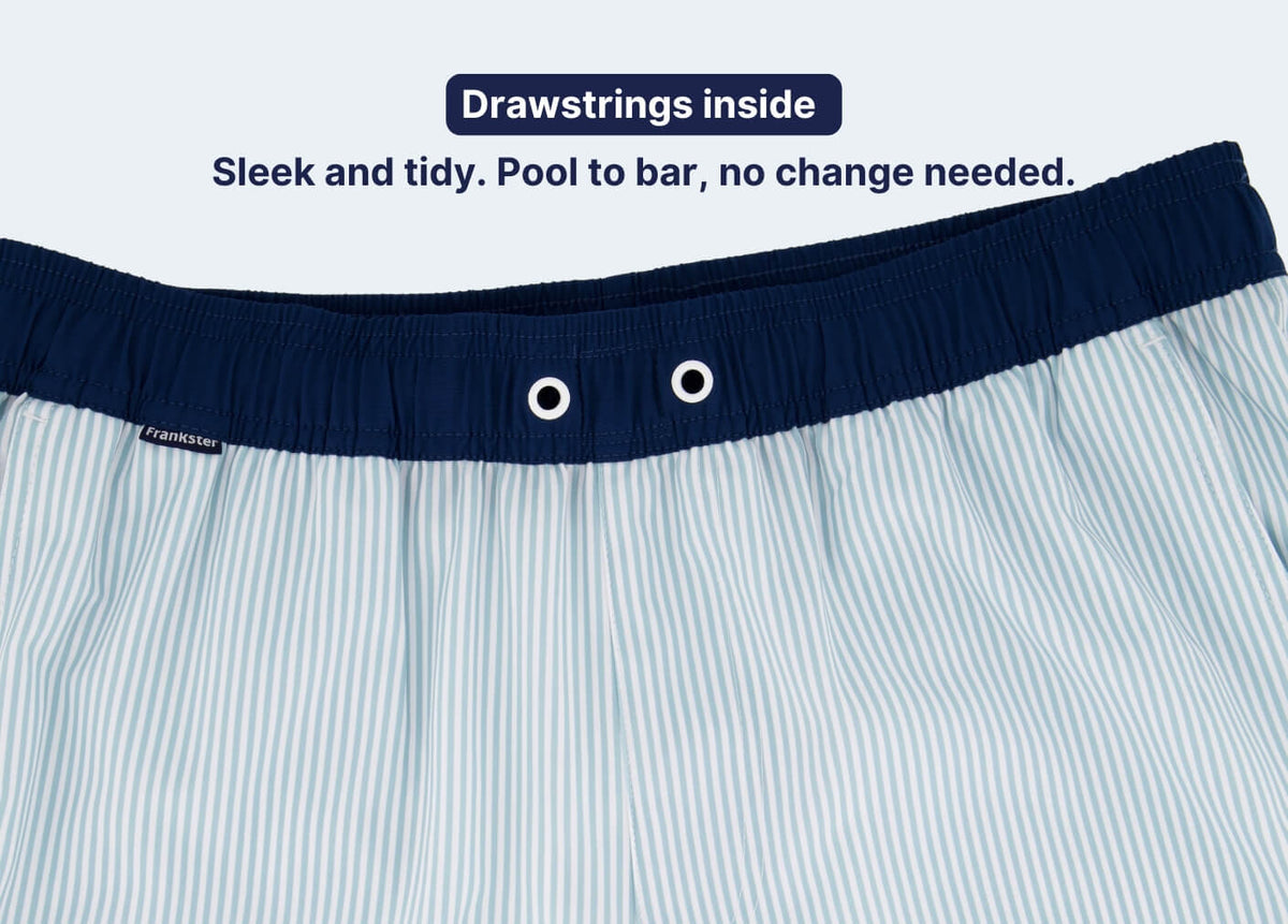Men's Shorts in light blue and white striped fabric with a navy elasticated waistband and hidden inner drawstrings