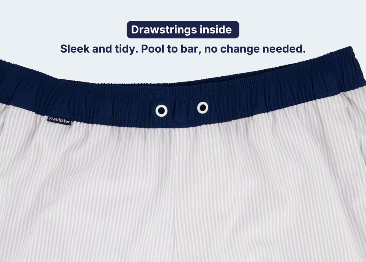 Men's Shorts in white pinstripe fabric with a navy elastic waistband and internal drawstrings for a neat fit