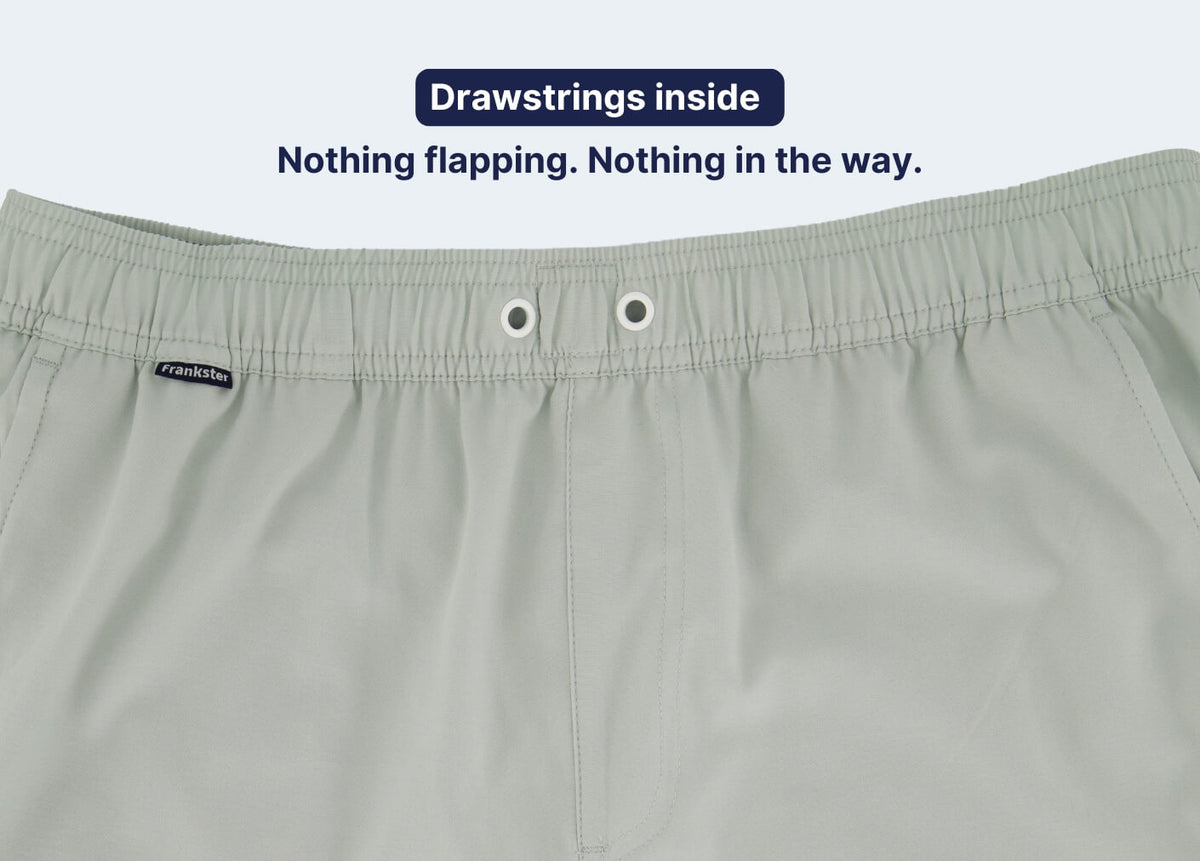 Light sage Men's Shorts with an elasticated waistband internal drawstring eyelets and smooth woven fabric