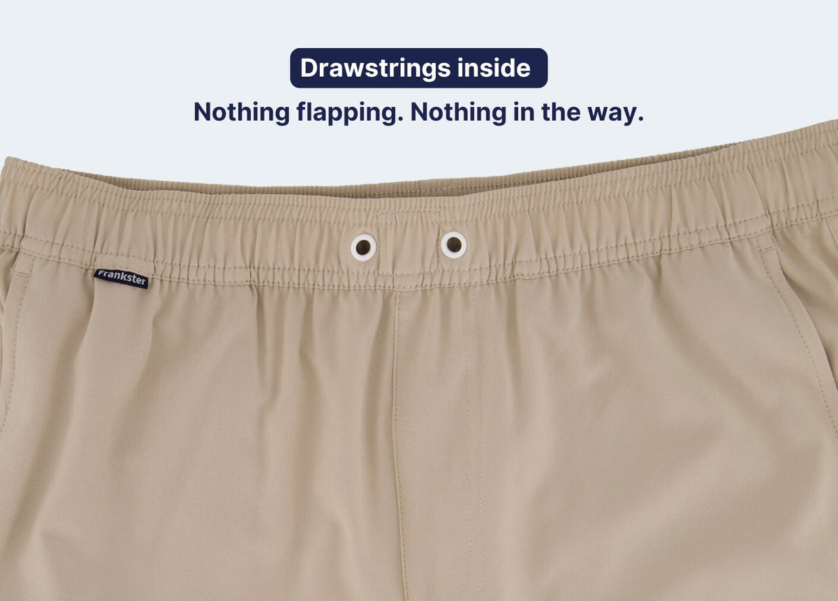 Beige Men's Shorts waistband in smooth fabric with concealed internal drawstrings and metal eyelets for a secure fit.