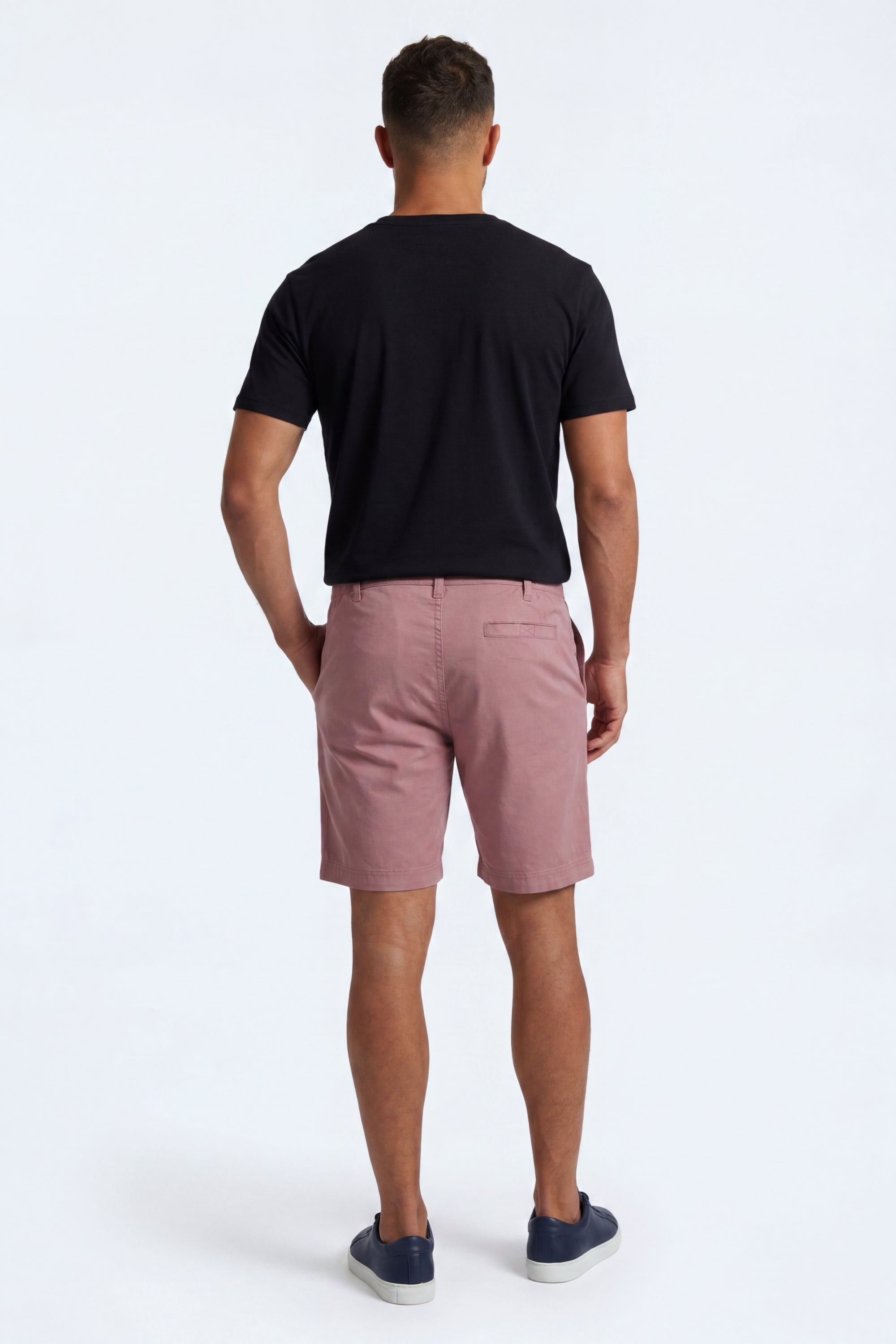 Back view of a man wearing Sundowners * The Everydays men's shorts in a dusty rose colour, made from soft, comfortable fabric by Frankster.