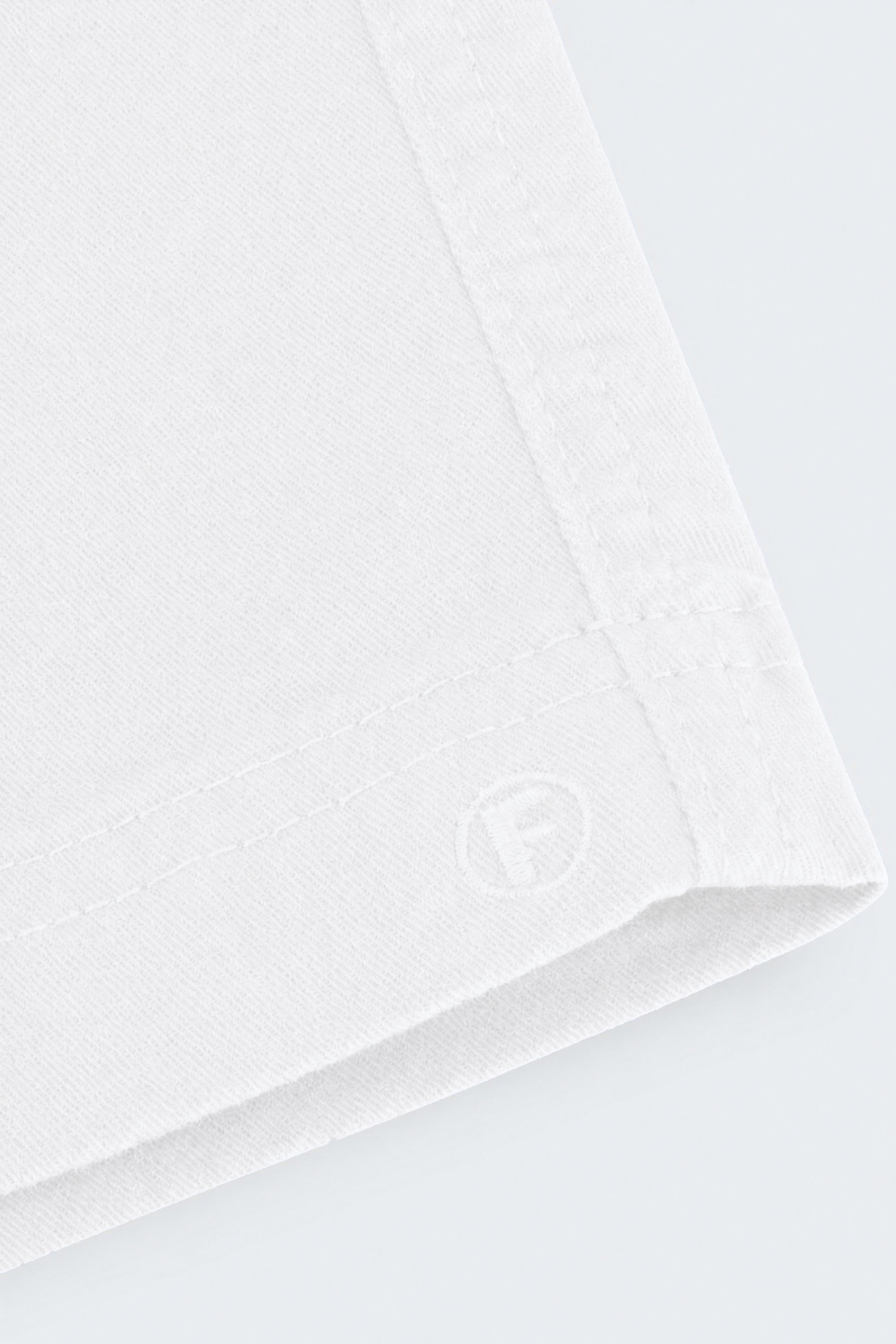 Close-up of white fabric detailing on Whitecaps * The Everydays men's shorts by Frankster, showcasing soft, durable material ideal for all-day comfort.