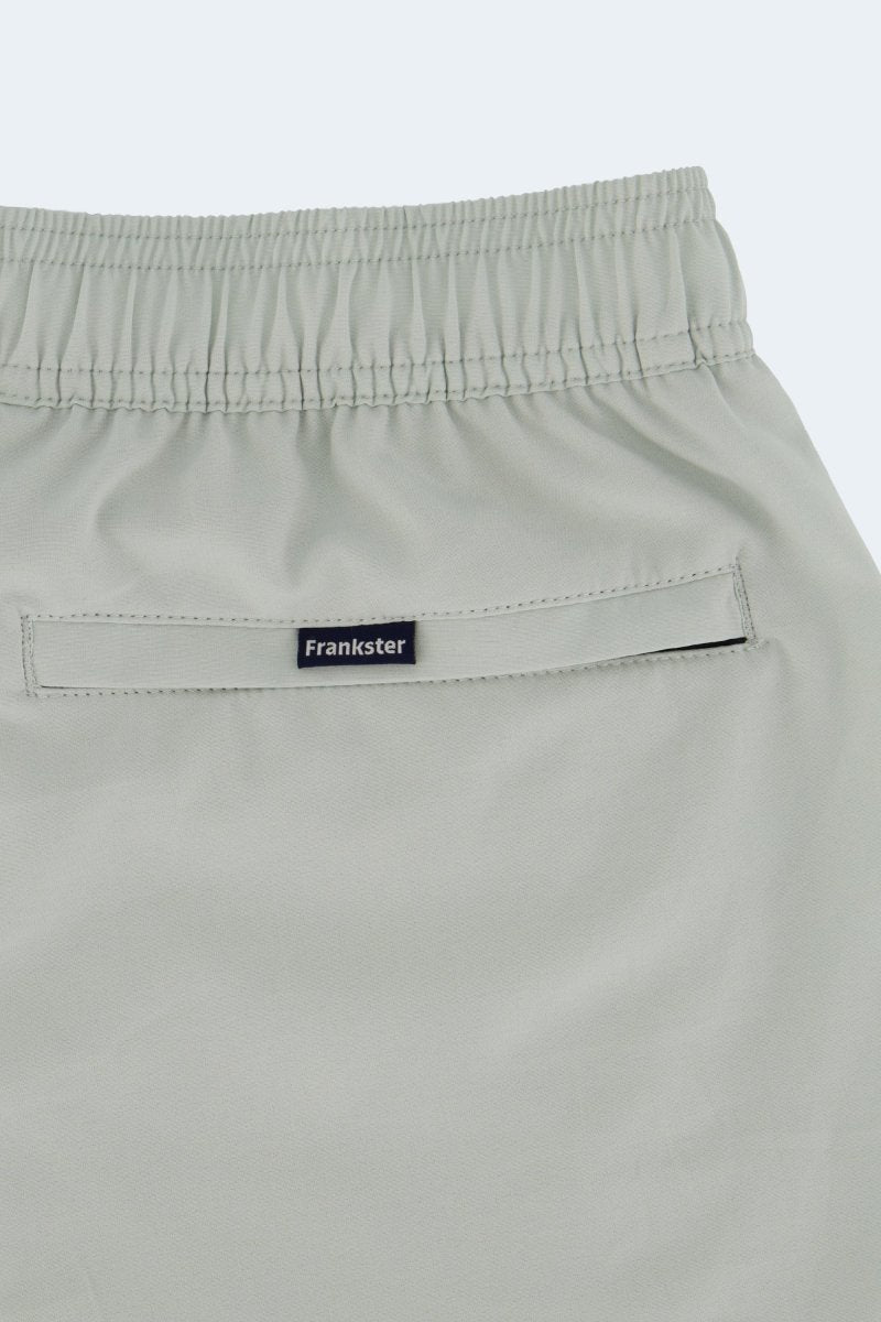 Evergreens * The Sporties Frankster Men's Shorts in pale sage green smooth fabric with elastic waistband and hidden zip pocket