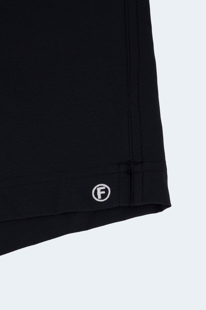 Midnights * The Sporties black Men's Shorts in smooth fabric with stitched hem detail and Frankster logo closeup
