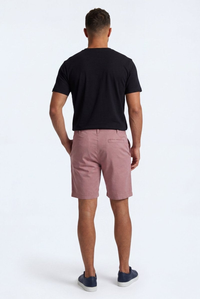 Back view of a man wearing Sundowners * The Everydays men's shorts in a dusty rose colour, made from soft, comfortable fabric by Frankster.
