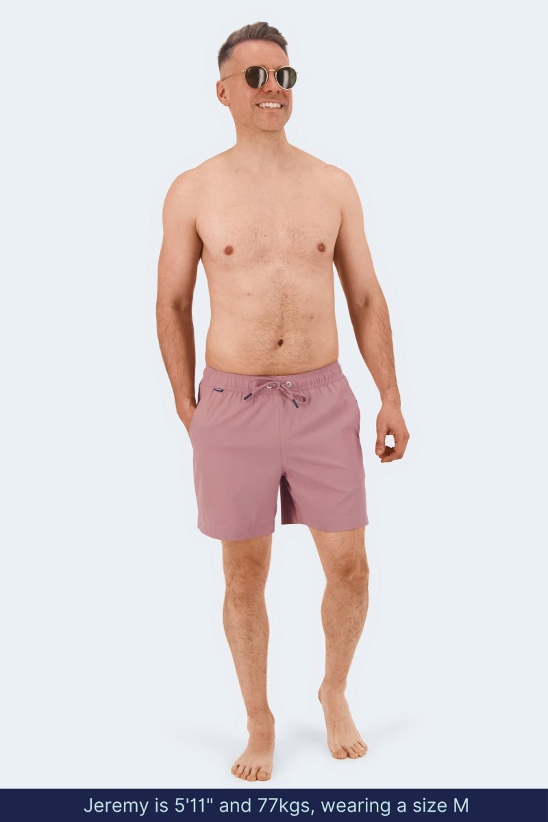 Frankster Sundowners * The Swims pink Men's Shorts on a model with elastic waistband and drawstring for comfortable swimwear w/ long-lasting wear