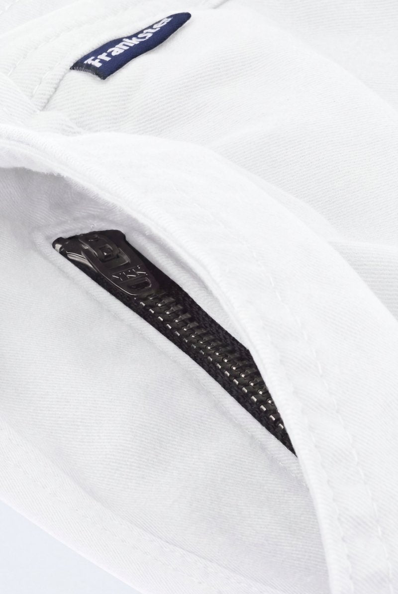 Close-up of white fabric men's shorts from Frankster featuring a black zipper pocket detail, highlighting comfort and premium material from Whitecaps * The Everydays.