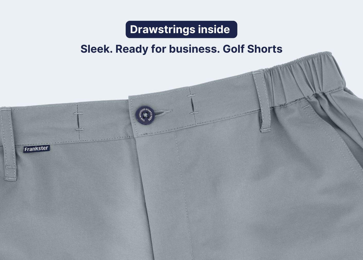 Grey Men's Shorts close up showing a partly elasticated waistband internal drawstrings belt loops and button fastening