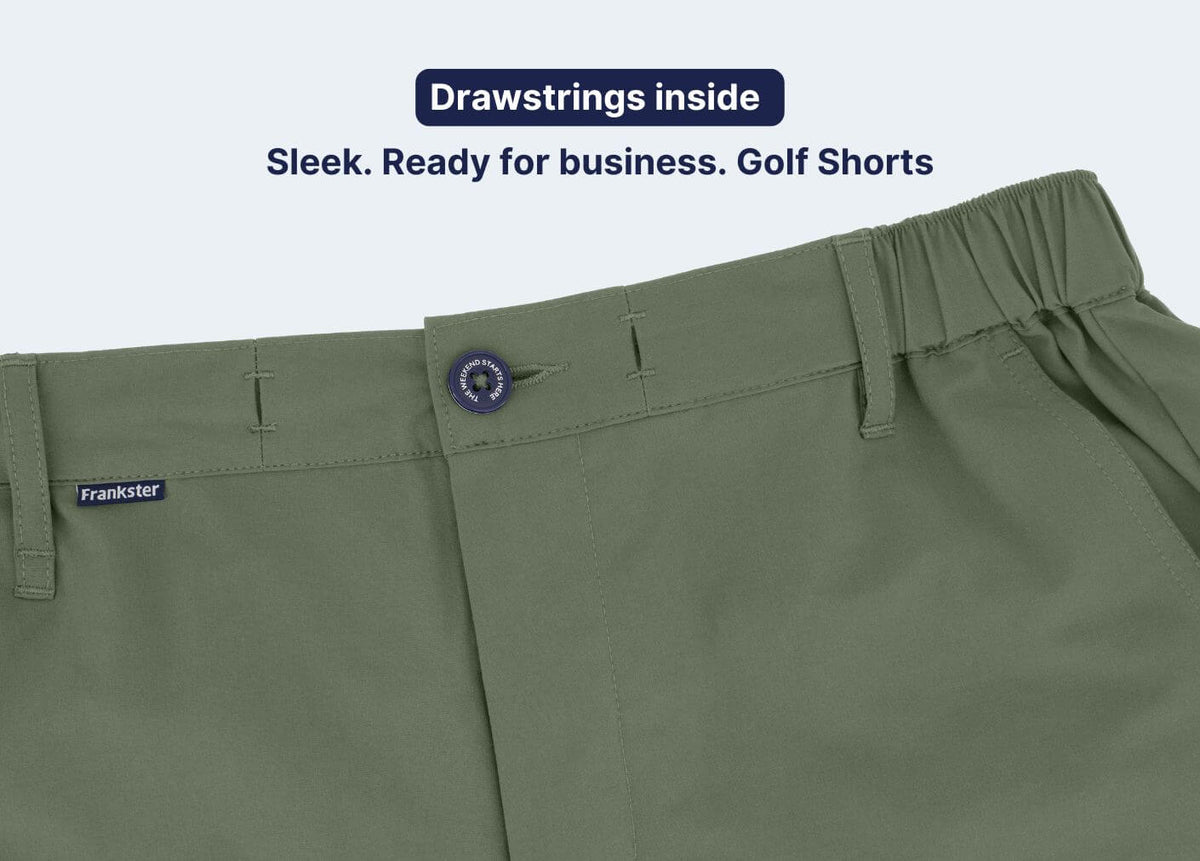 Close-up of olive green fabric Men's Shorts showing the waistband, internal drawstrings, belt loops and button fastening