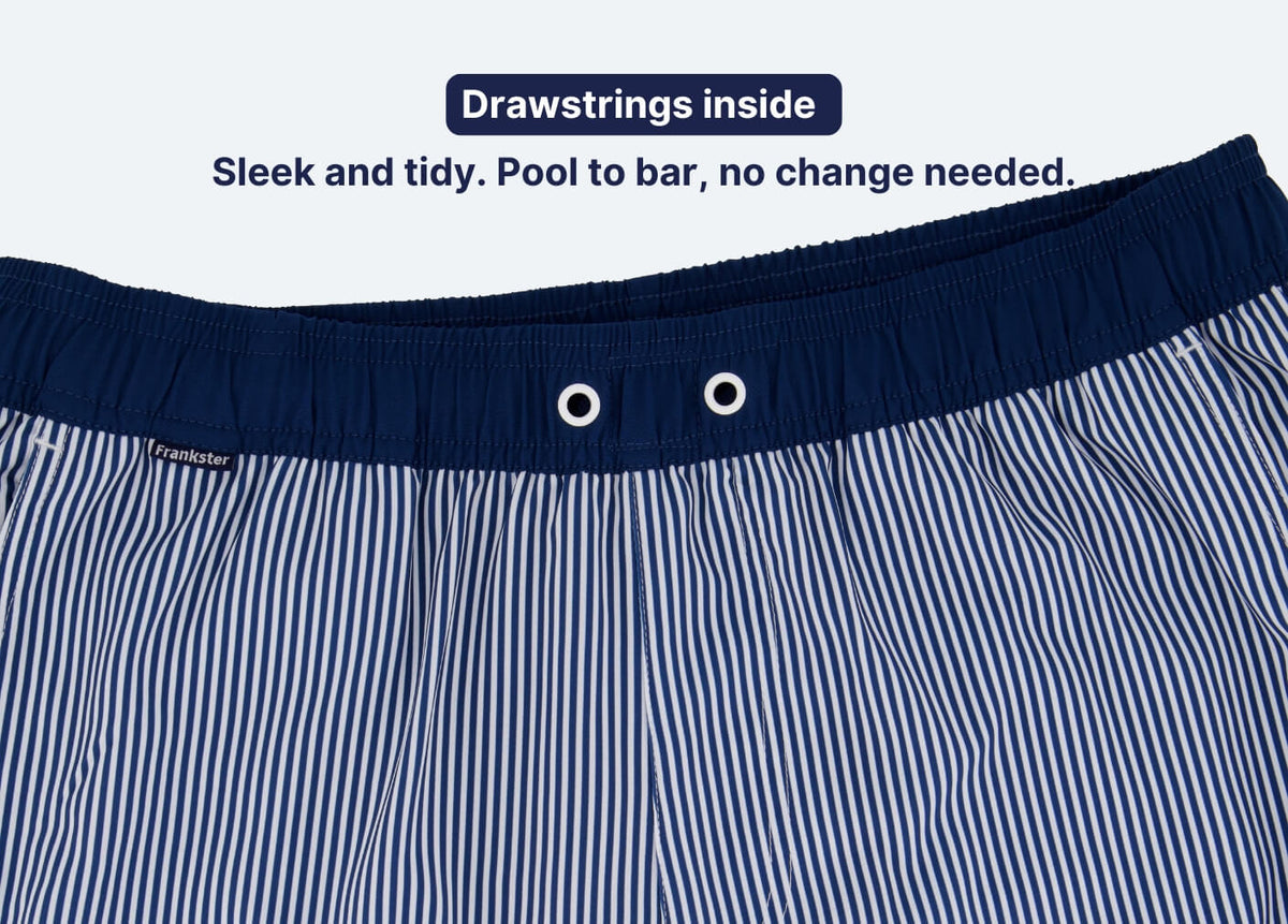 Close-up of navy and white striped Men's Shorts with an elastic waistband and visible eyelets for an internal drawstring