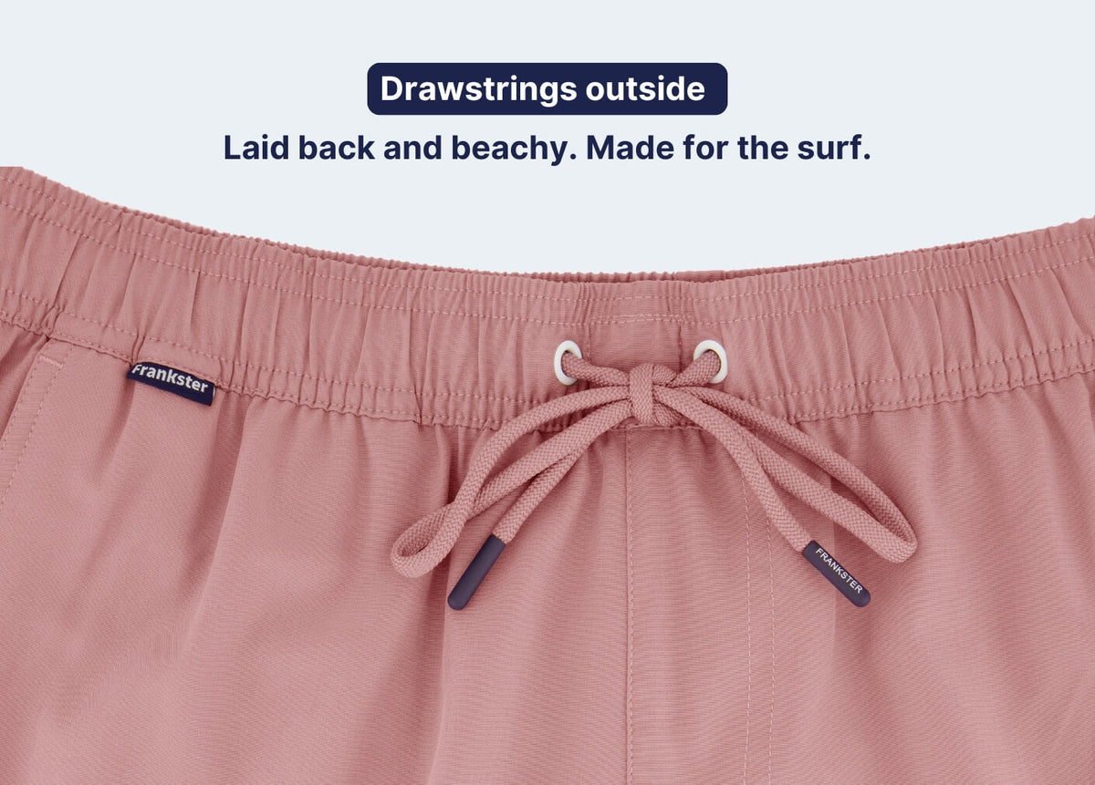 Pink Men's Shorts close-up showing an elasticated waistband, external drawstrings and soft textured fabric