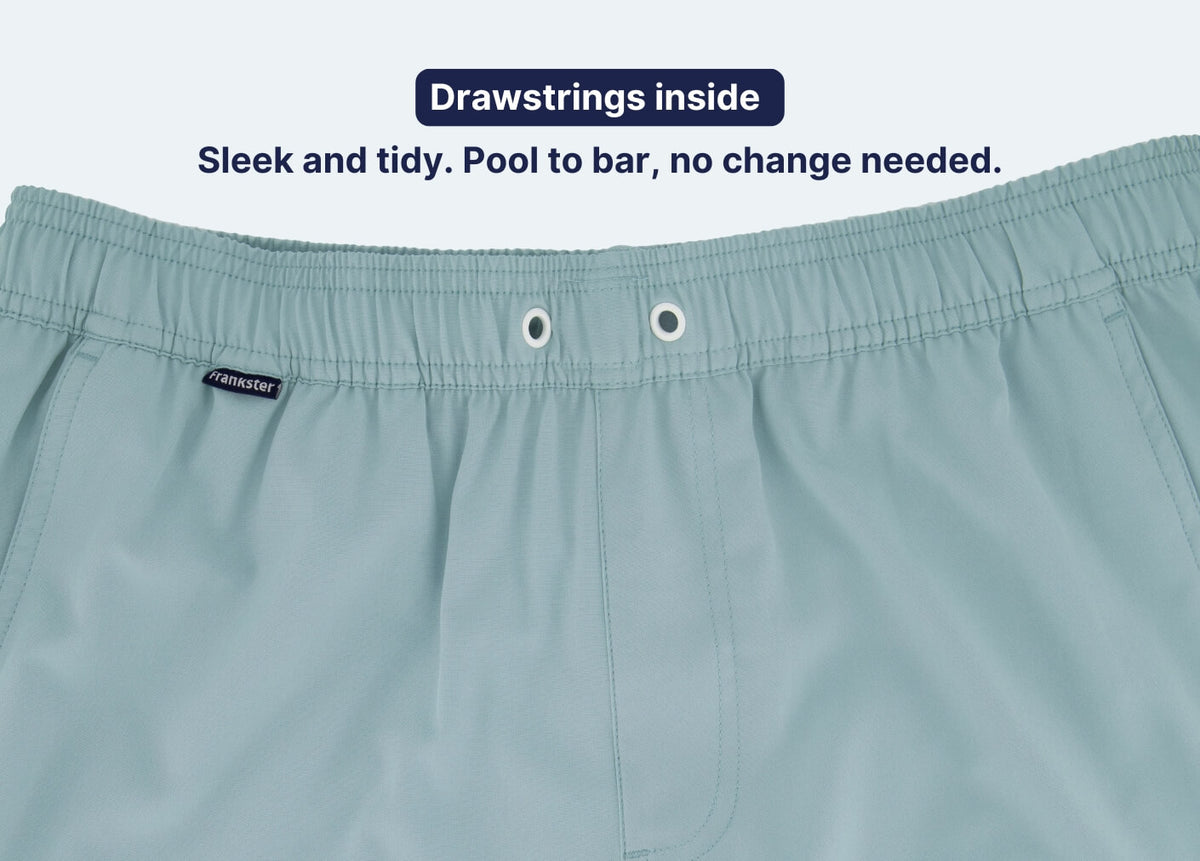 Men's Shorts in light blue fabric with an elasticated waistband and hidden internal drawstrings for a sleek tidy finish