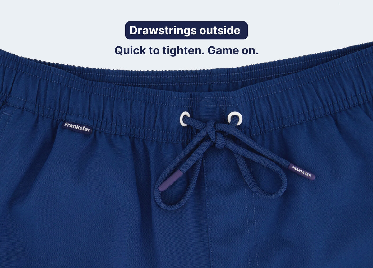 Blue Men's Shorts close-up showing textured fabric an elasticated waistband and an external drawstring for quick adjustment