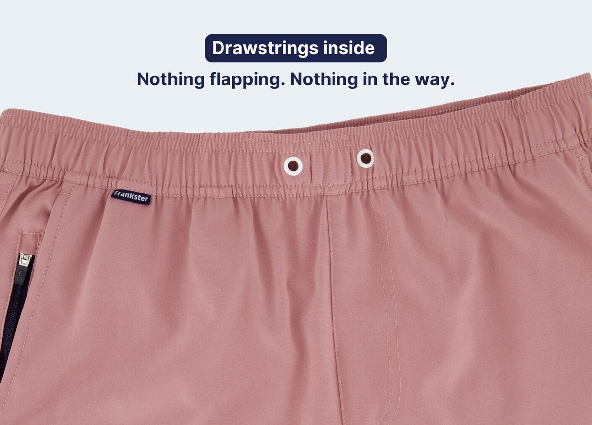 Pink Men's Shorts close-up with an elastic waistband, internal drawstrings, eyelets and a side zip pocket