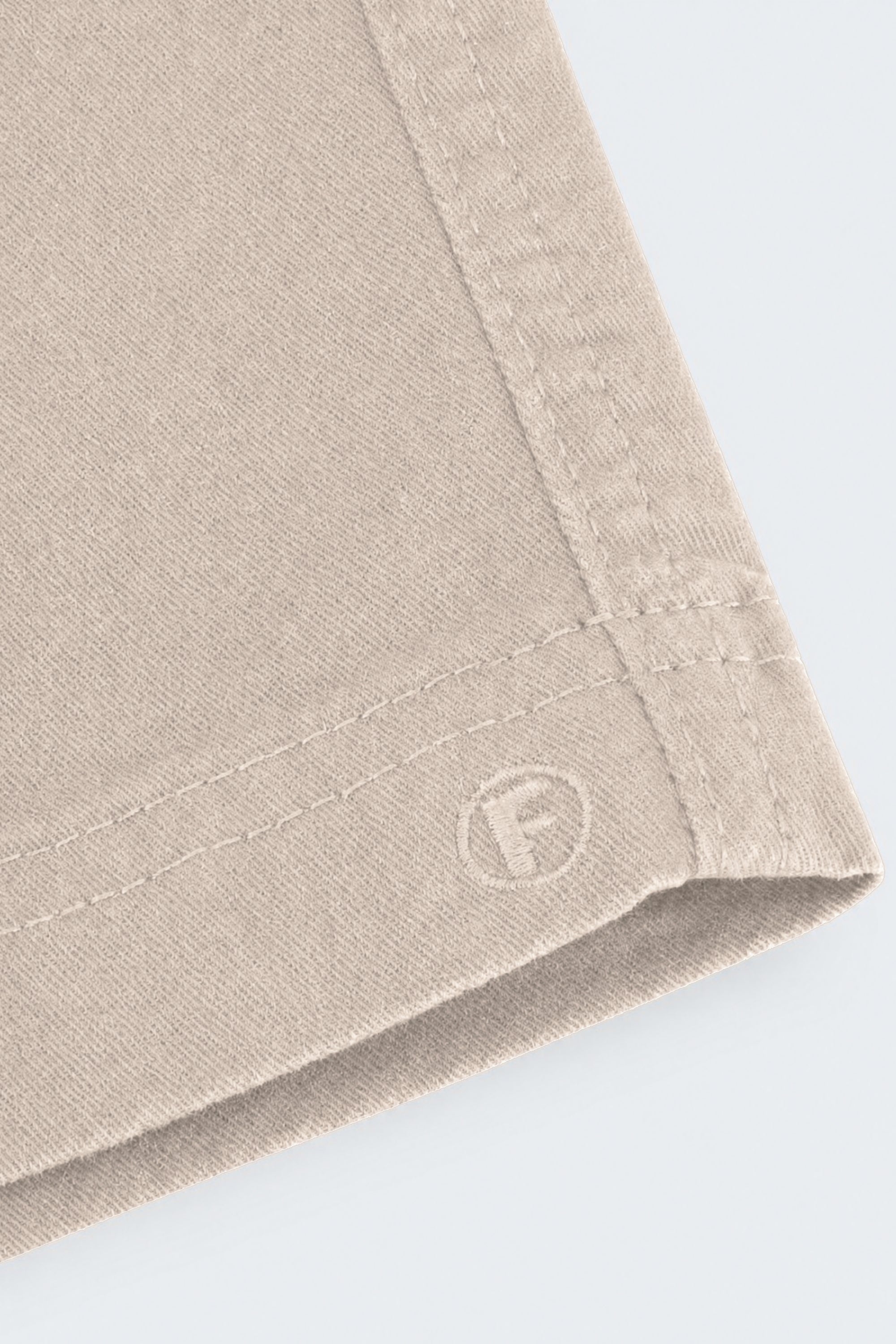 Close-up of beige Shores * The Everydays men's shorts by Frankster, showcasing soft fabric texture and detailed stitching for comfortable wear.