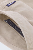 Close-up of beige men's shorts by Frankster featuring a soft fabric texture and a hidden black zip pocket from Shores * The Everydays collection.