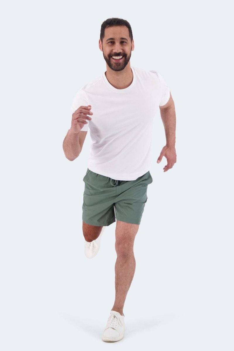 Frankster Caddies * The Sporties green fabric Men's Shorts shown on a running man as versatile Shorts for Men