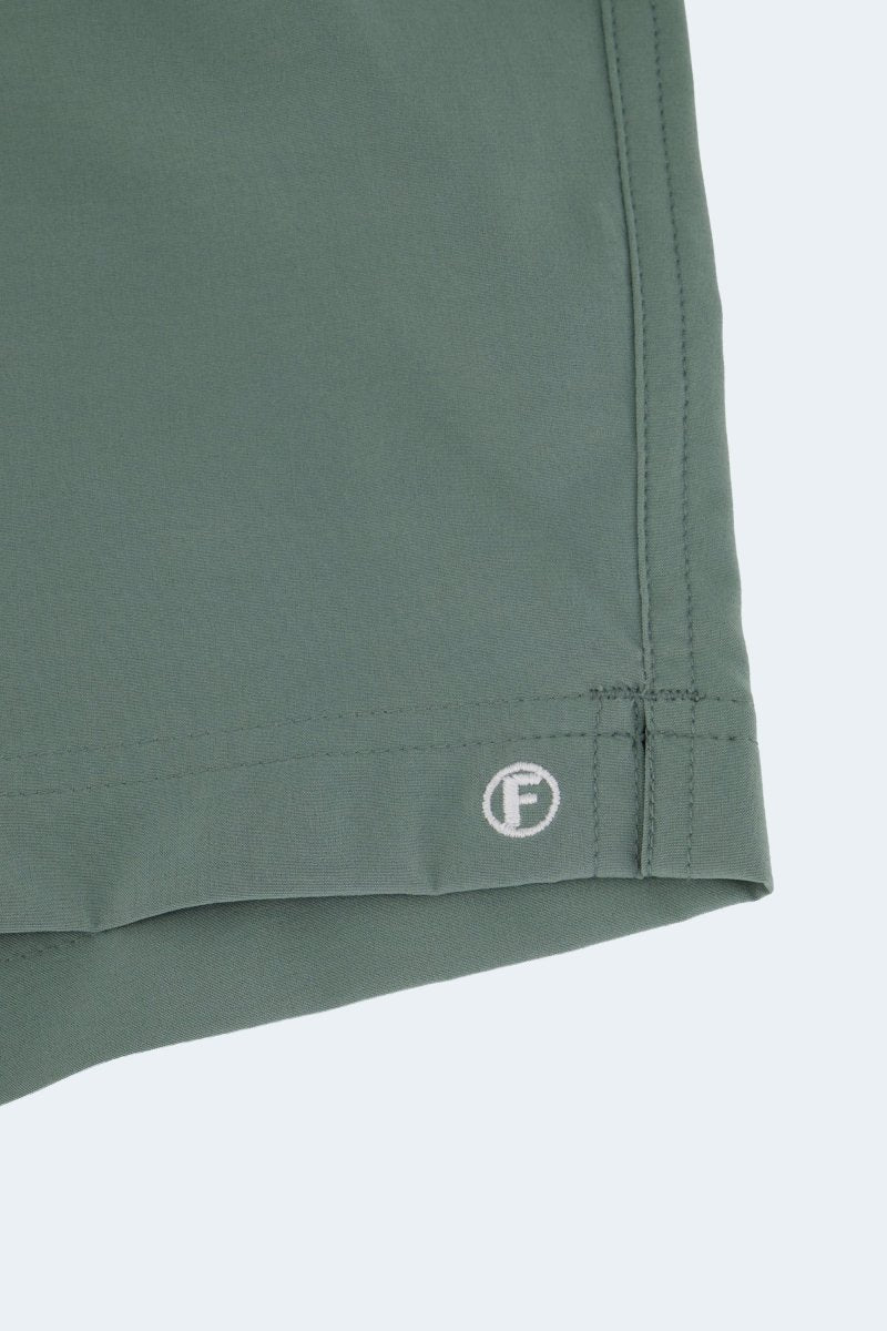 Frankster Caddies * The Sporties Men's Shorts in muted green fabric with stitched hem and embroidered logo detail