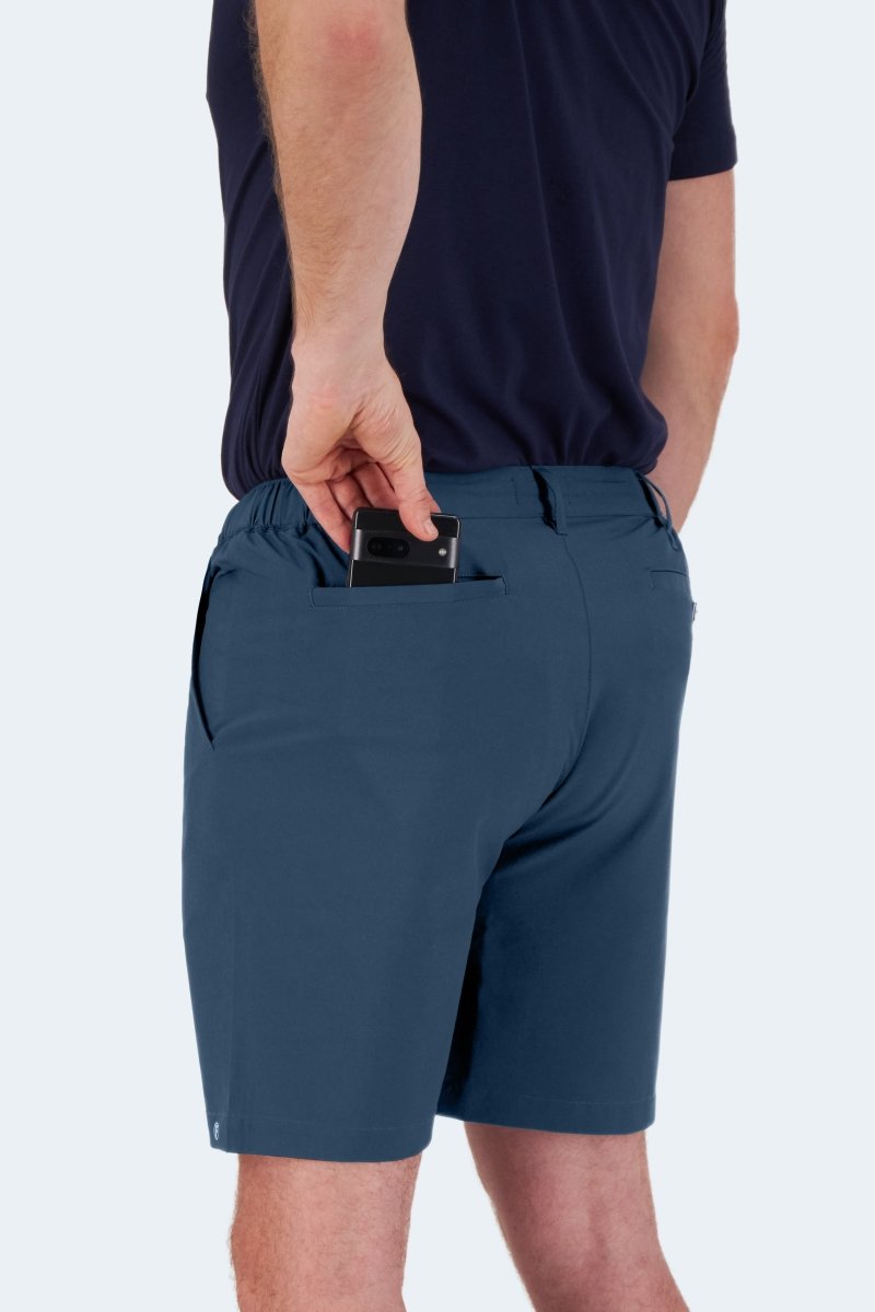 Man wearing Frankster Chillers * The Actives men's shorts in dark blue lightweight fabric reaching mid-thigh outdoors