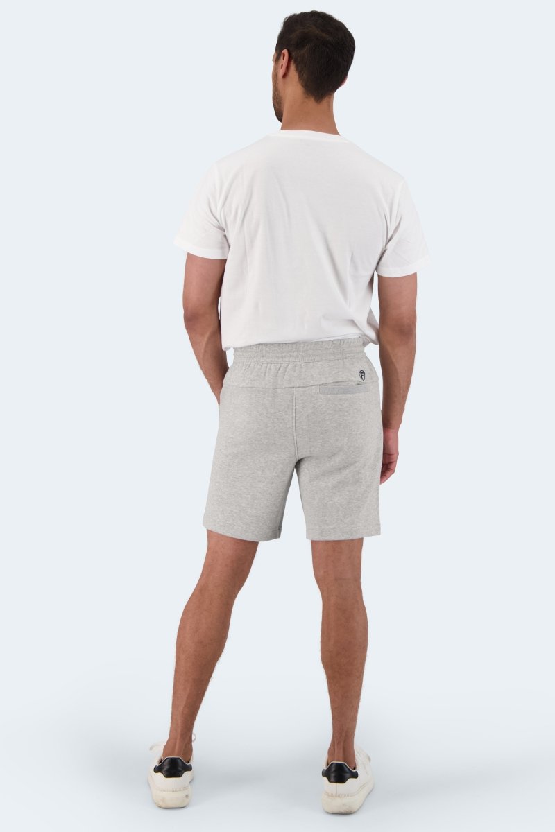 Man wearing light grey Frankster Lunars * The Comfies men's shorts made of soft lounge fabric standing with back view