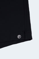 Midnights * The Sporties black Men's Shorts in smooth fabric with stitched hem detail and Frankster logo closeup