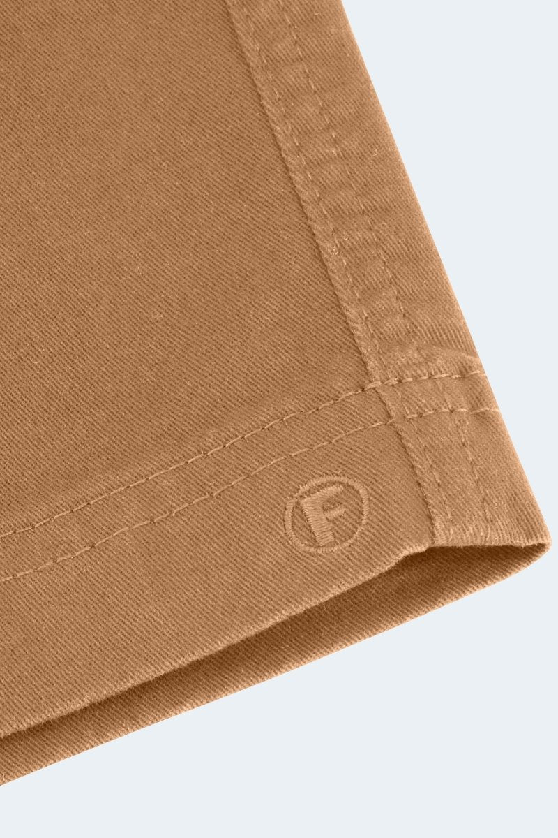 Close-up of Frankster Mokas * The Everydays men's shorts in brown stretch cotton fabric showing detailed stitching and logo embossing