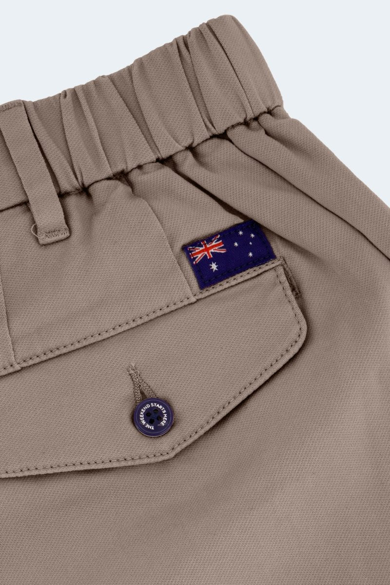 Close-up of Frankster Nomads * The Aussies men's shorts in dark khaki cotton with elastic waistband and Australian flag patch