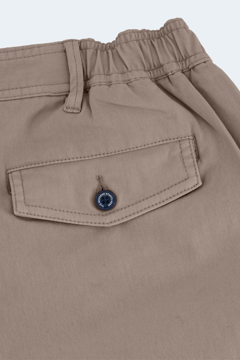 Close-up of Nomads * The Shorties men's shorts in dark khaki stretch cotton featuring a back button pocket by Frankster