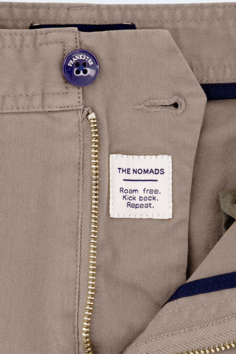 Close-up of Frankster Nomads * The Shorties men's shorts in dark khaki stretch cotton with zipper and branded button details