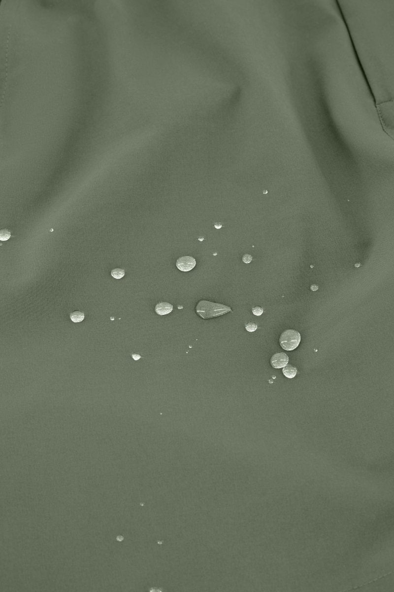 Close up of army green Frankster Rebels * The Actives men's shorts fabric showing water repellant lightweight material texture