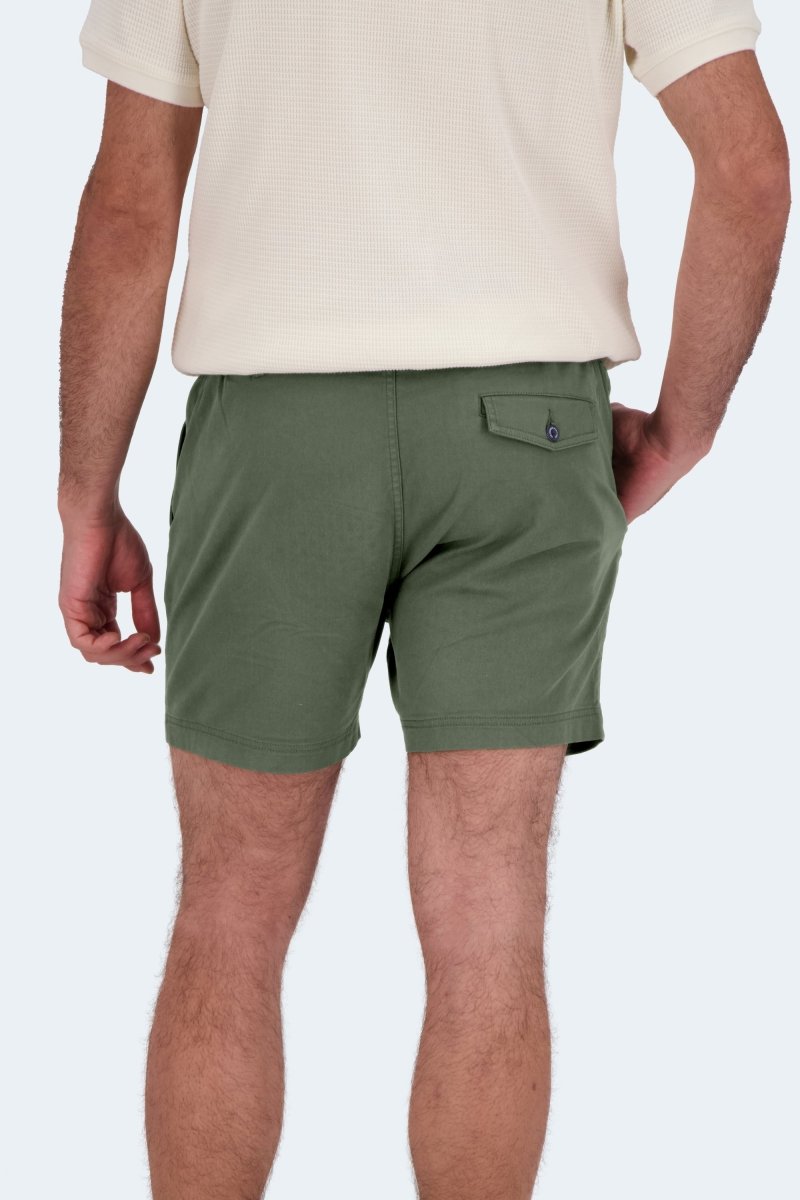 Man wearing olive green Rebels * The Shorties stretch cotton men's shorts by Frankster viewed from the back