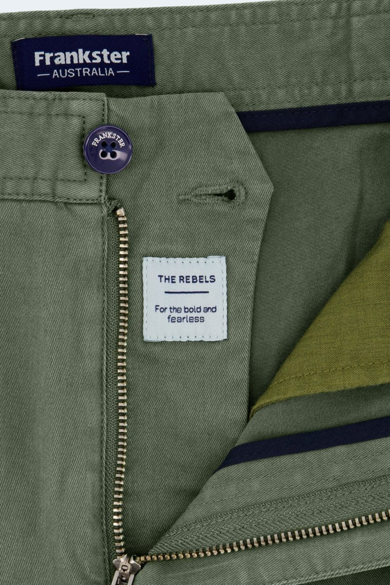 Close-up of olive green stretch cotton Rebels * The Shorties men's shorts by Frankster with branded button and zipper details