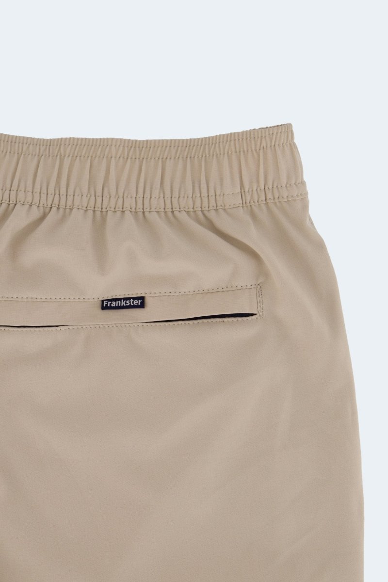 Sandbars * The Sporties Frankster Men's Shorts in beige fabric with an elasticated waistband and hidden zip pocket