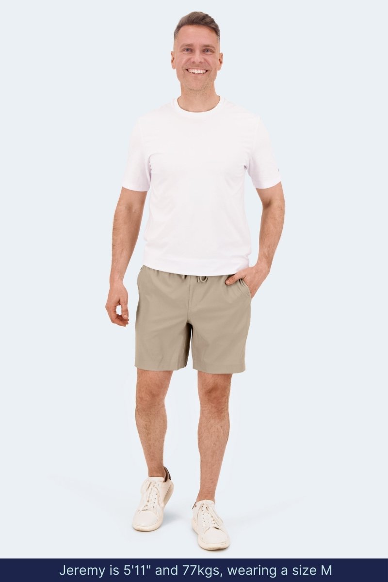 Frankster Sandbars * The Sporties Men's Shorts in beige, modelled with a white T shirt and sneakers for relaxed everyday wear