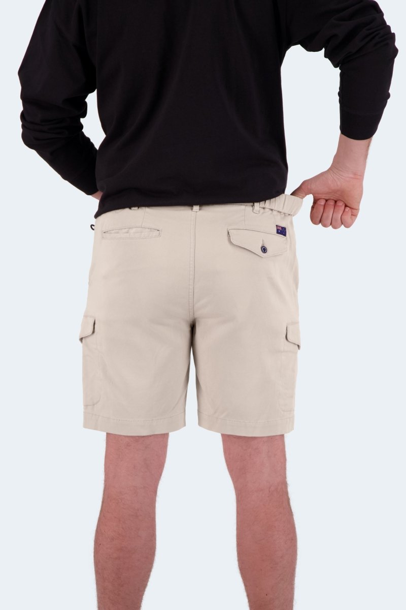 Back view of Shores * The Aussies light khaki cotton men's shorts by Frankster worn with black long sleeve top