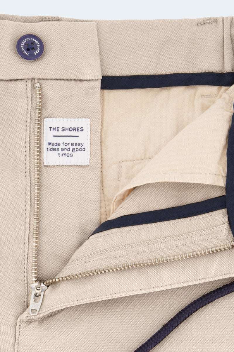 Close-up of Shores * The Aussies light khaki Frankster men's shorts showing cotton fabric texture and zipper detail