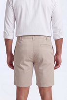 Back view of a man wearing beige Shores * The Everydays men's shorts by Frankster, made from soft, comfortable fabric ideal for all-day wear