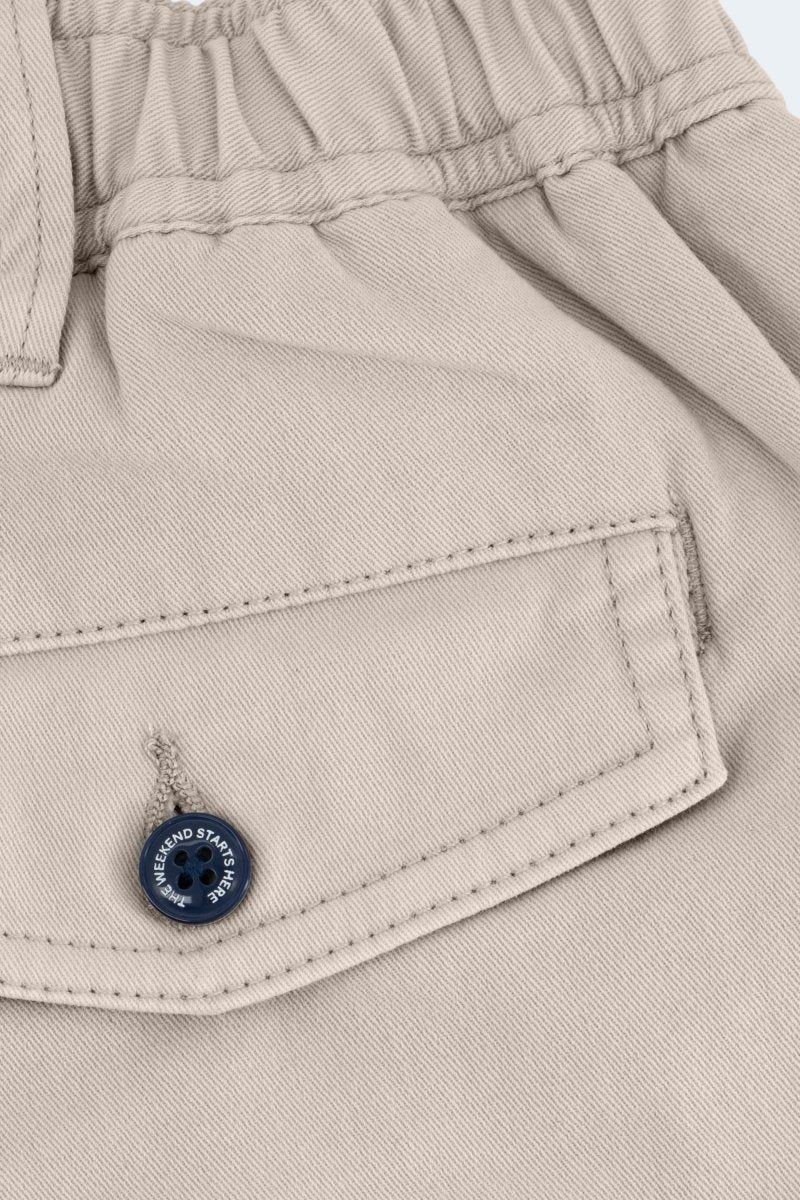 Close-up of light khaki stretch cotton Shores * The Shorties men's shorts by Frankster showing back pocket with button detail