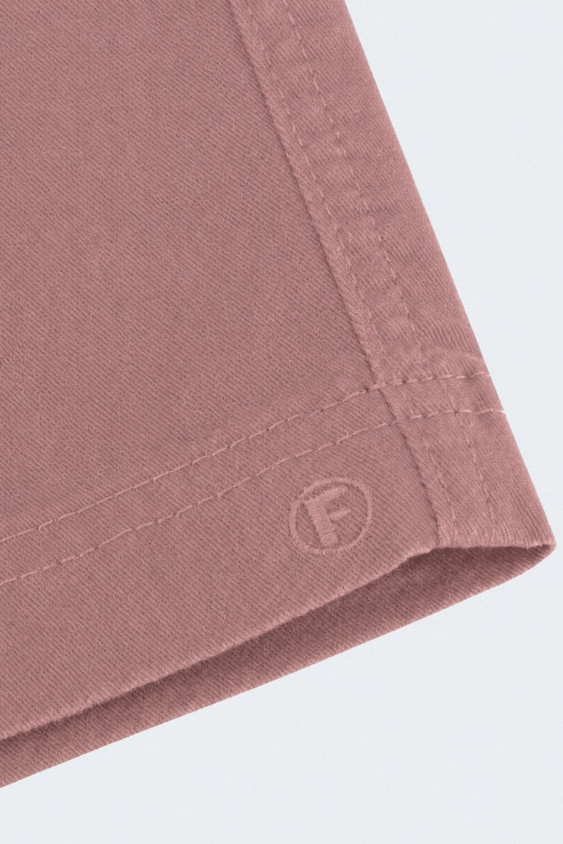 Close-up of dusty pink men's shorts corner showing soft, durable fabric and stitched hem from Frankster's Sundowners * The Everydays collection.