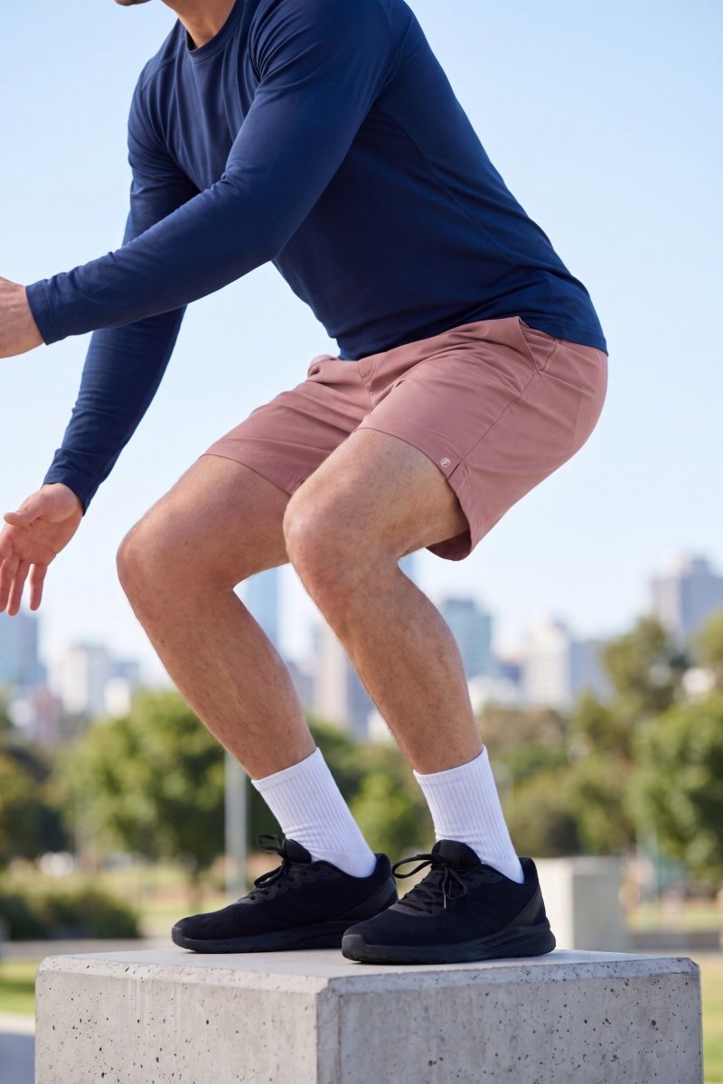 Frankster Sundowners * The Sporties Men's Shorts in dusty pink fabric shown during outdoor exercise with a comfortable fit