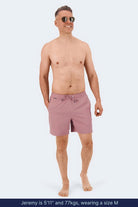 Frankster Sundowners * The Swims pink Men's Shorts on a model with elastic waistband and drawstring for comfortable swimwear w/ long-lasting wear