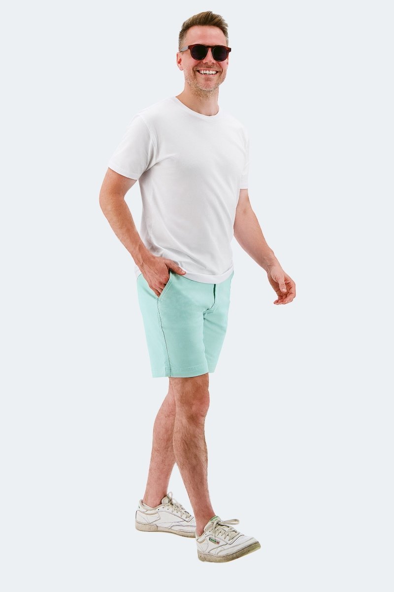 Man wearing light green stretch cotton men's shorts Rays * The Everydays by Frankster with white t-shirt and sneakers