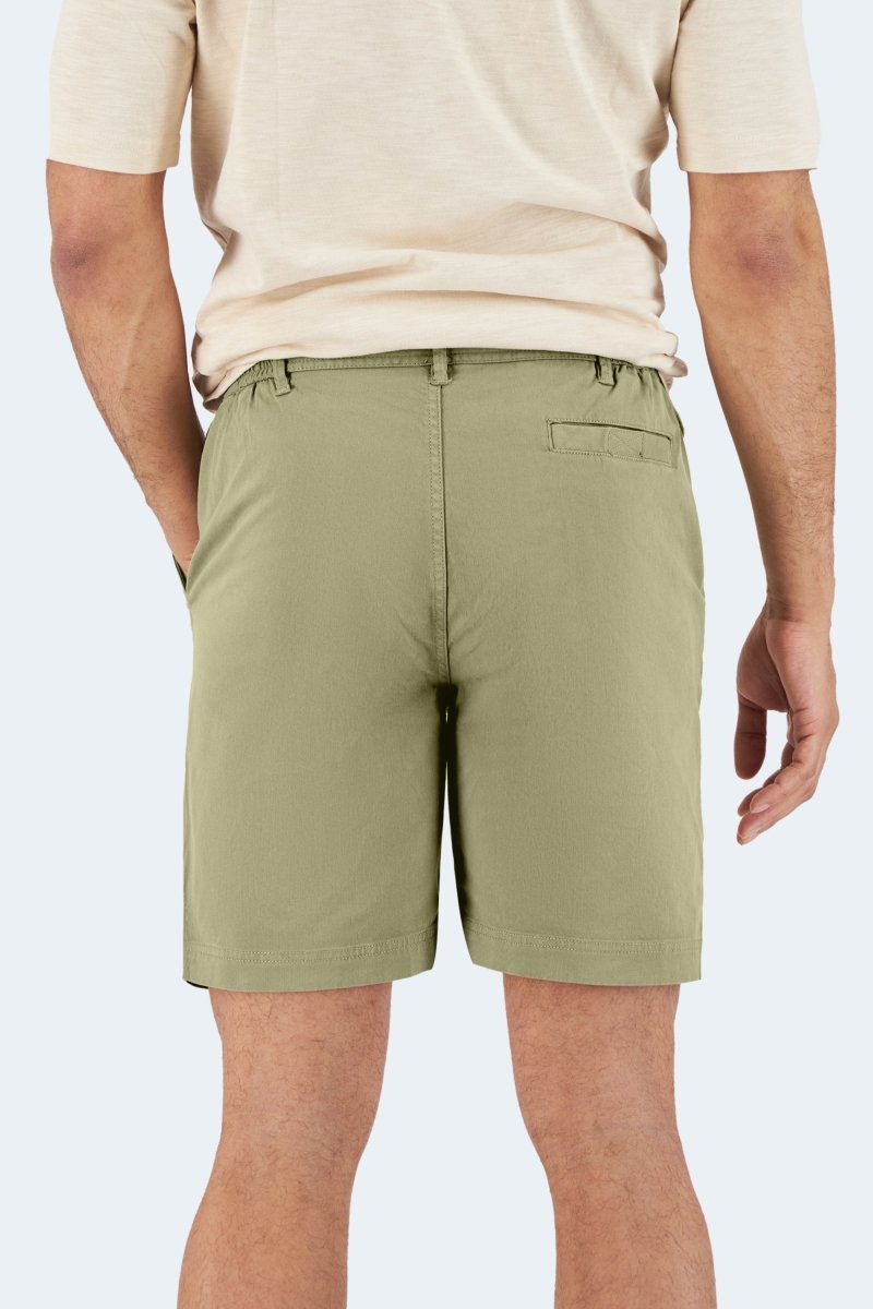 Back view of Frankster Virgins * The Everydays olive green stretch cotton men's shorts worn by a male model