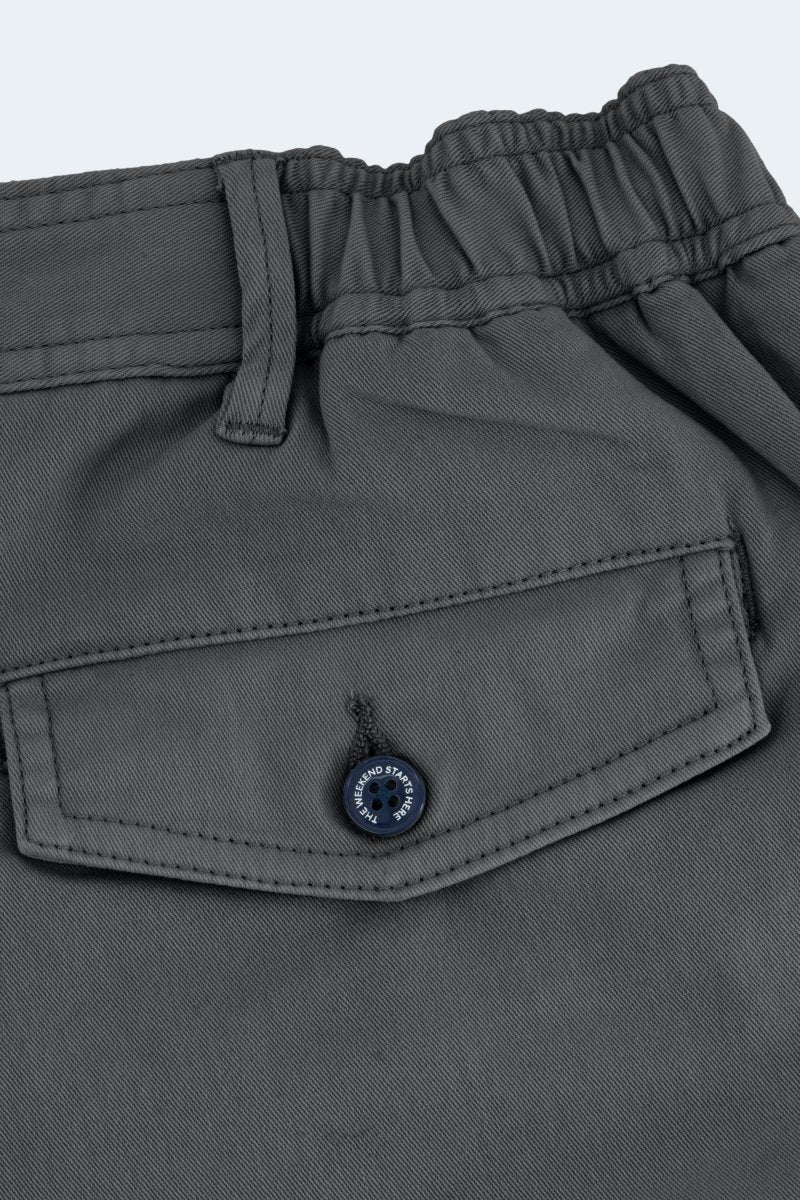 Close-up of dark grey stretch cotton Volcans * The Shorties men's shorts by Frankster featuring buttoned back pocket and elastic waistband