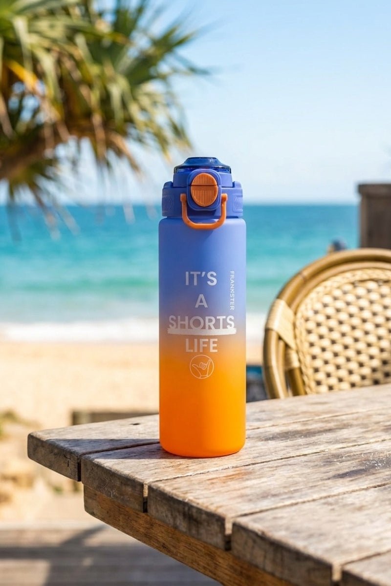 Water Bottle Orange Blue with a vibrant blue and orange gradient, featuring durable material perfect for outdoors, complementing casual men's shorts styles.